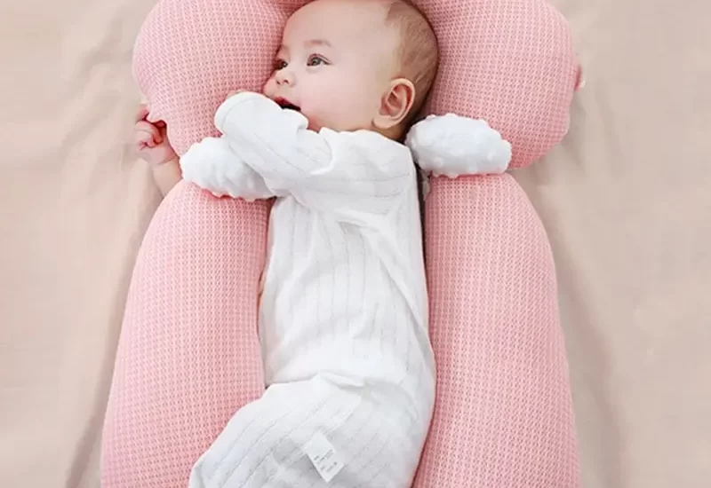 babies sleep with a pillow